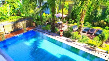 Outdoor pool, open 7:00 AM to 9:00 PM, pool umbrellas, pool loungers