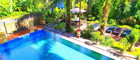 Outdoor pool, open 7:00 AM to 9:00 PM, pool umbrellas, pool loungers