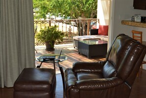 Studio Suite, 1 King Bed | Living area | 32-inch LCD TV with satellite channels, TV, iPod dock - San Angel Suites (Cabo San Lucas)