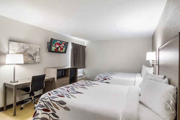 Deluxe Room, 2 Queen Beds, Non Smoking | Desk, laptop workspace, blackout drapes, iron/ironing board