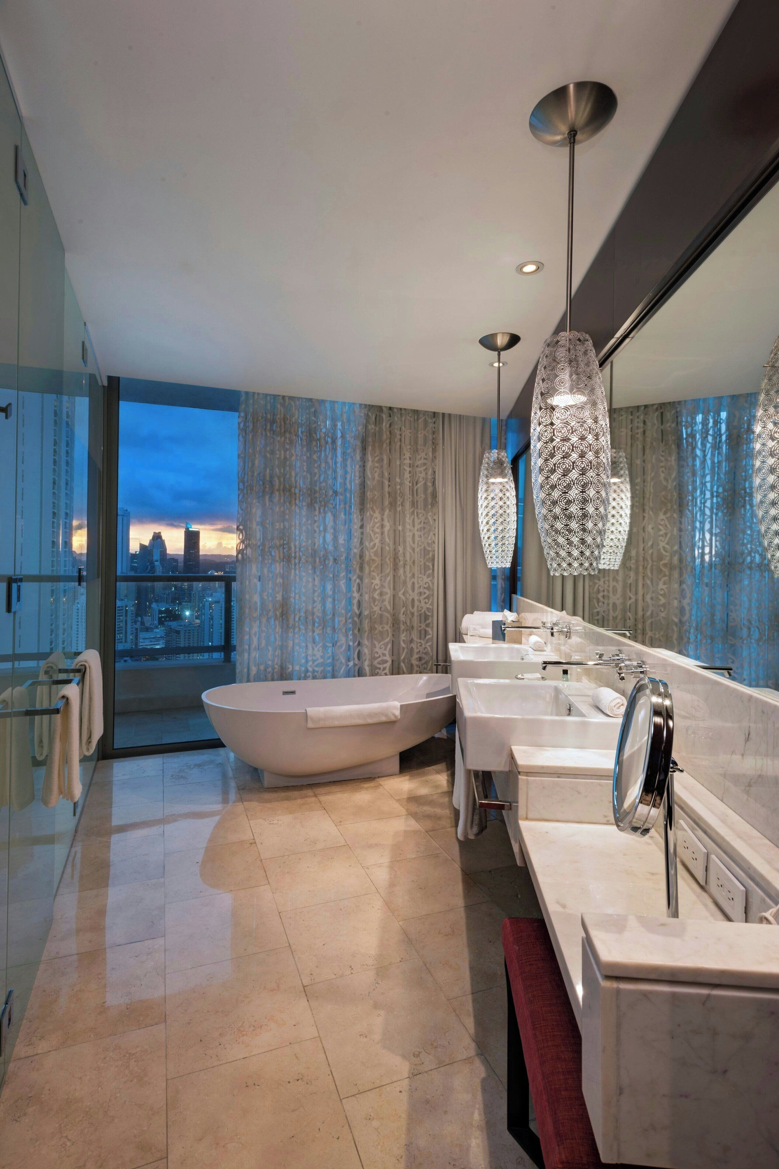 separate bathtub and shower, designer toiletries, hair dryer, slippers