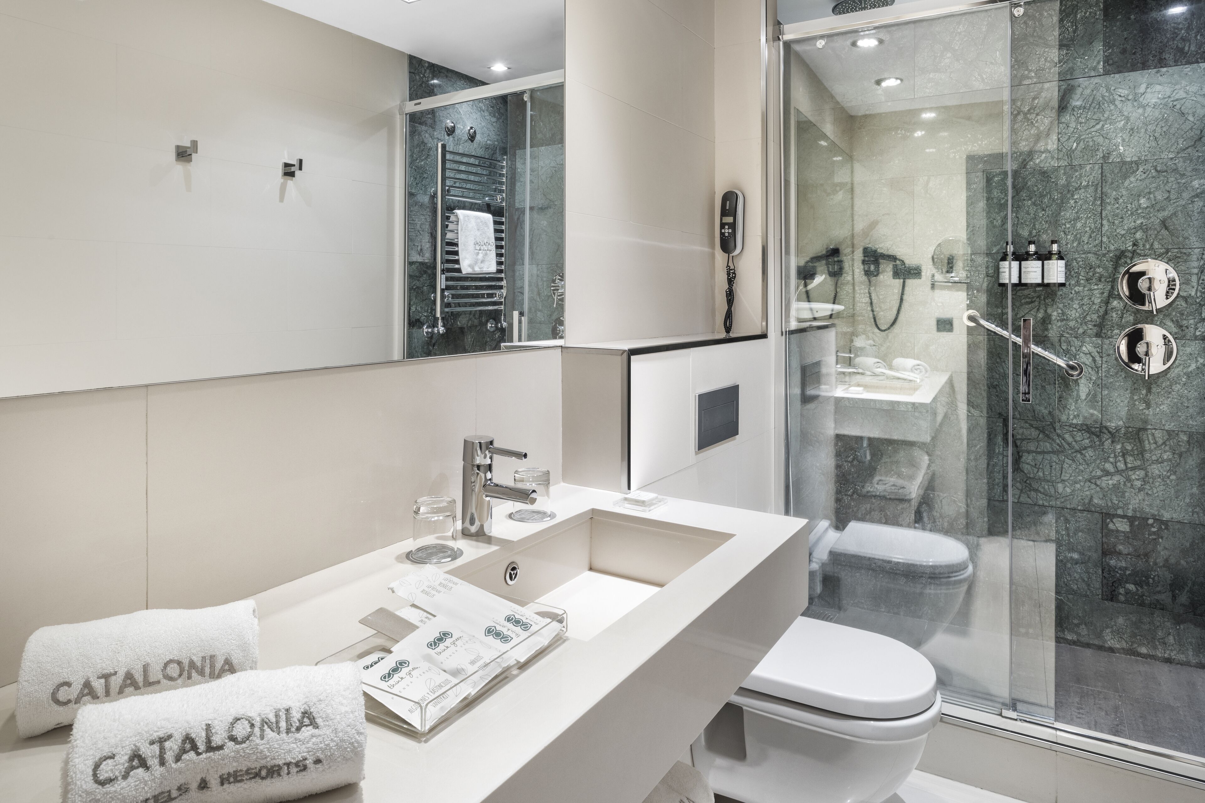 eco-friendly toiletries, hair dryer, towels