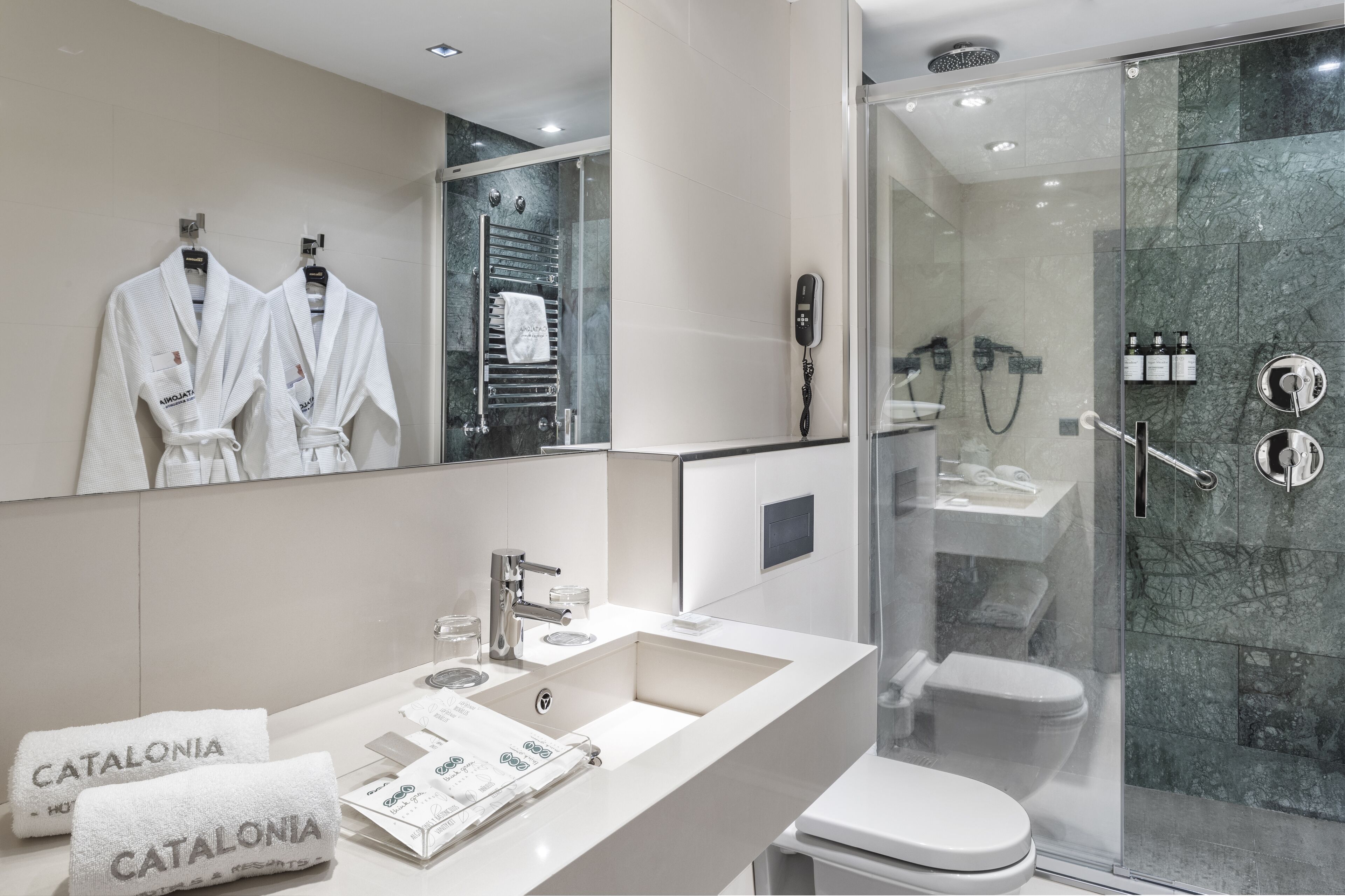 eco-friendly toiletries, hair dryer, towels