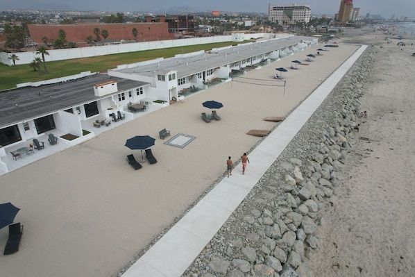 Private beach, beach volleyball, surfing