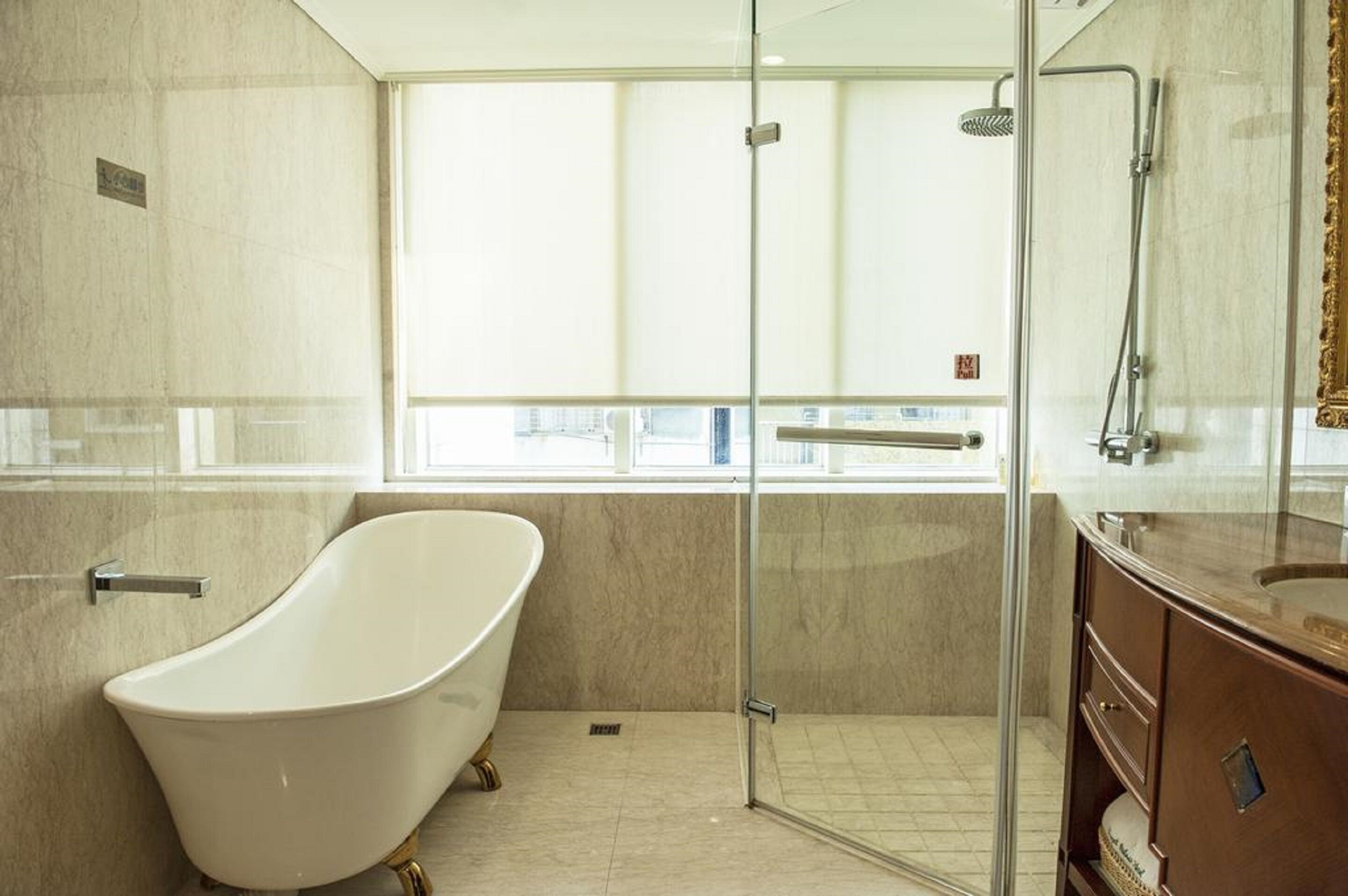 deluxe double room, 1 king bed | bathroom | free toiletries, hair dryer, slippers, towels