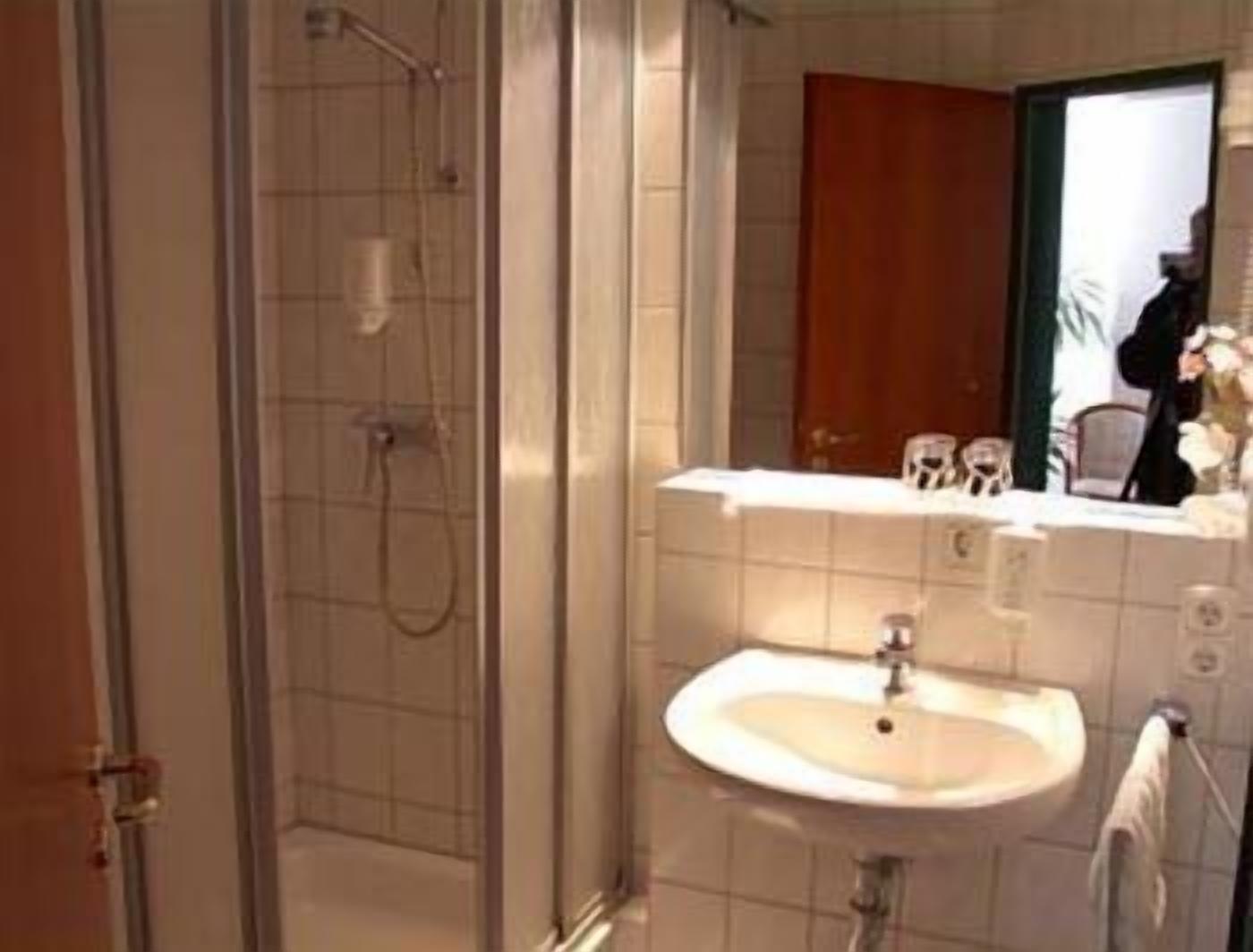 shower, rainfall showerhead, hair dryer, towels