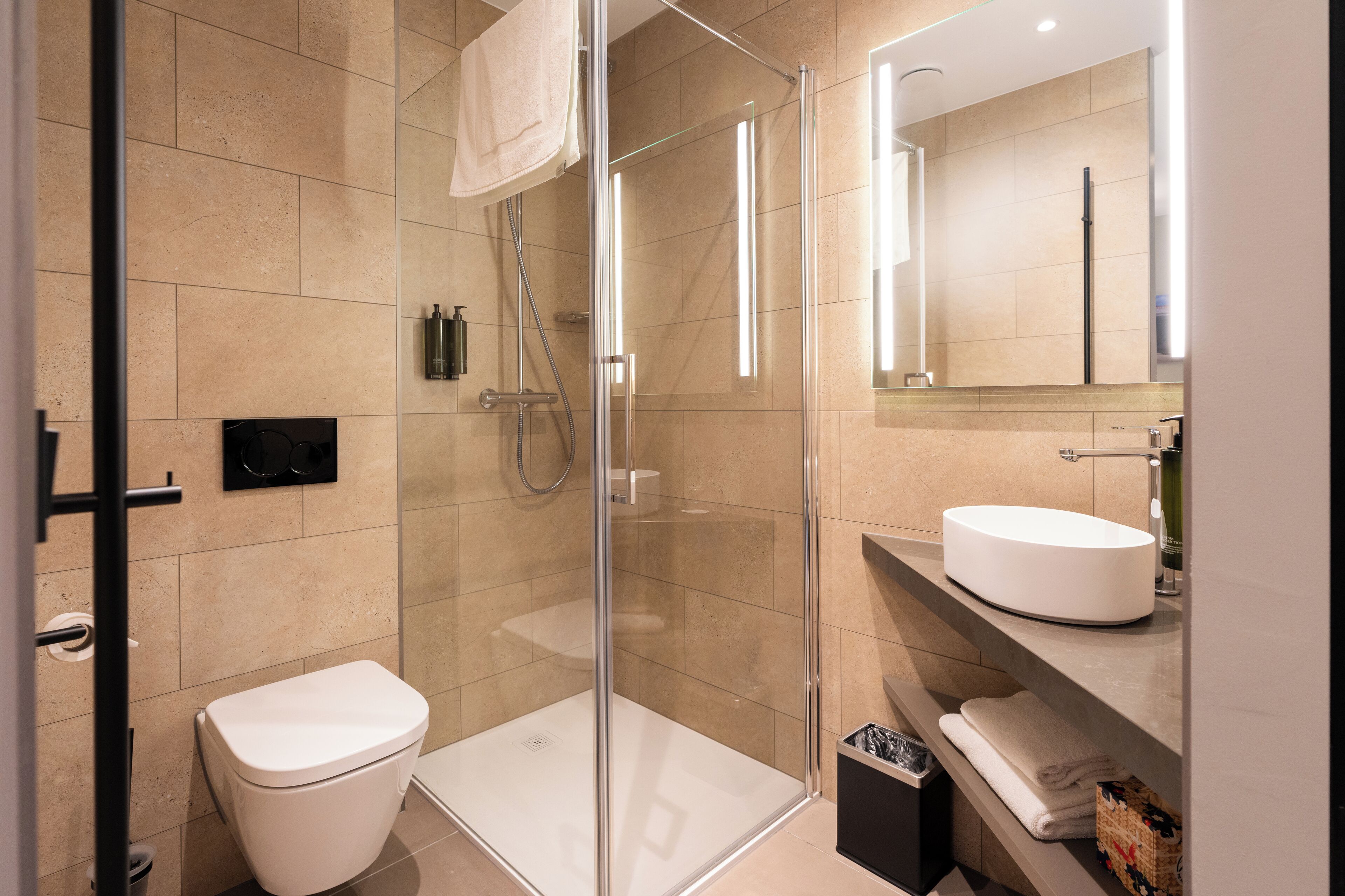 premium single room | bathroom | shower, free toiletries, hair dryer, towels