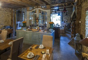Enjoy a traditional dining experience with a view of the outdoors from this cozy space.