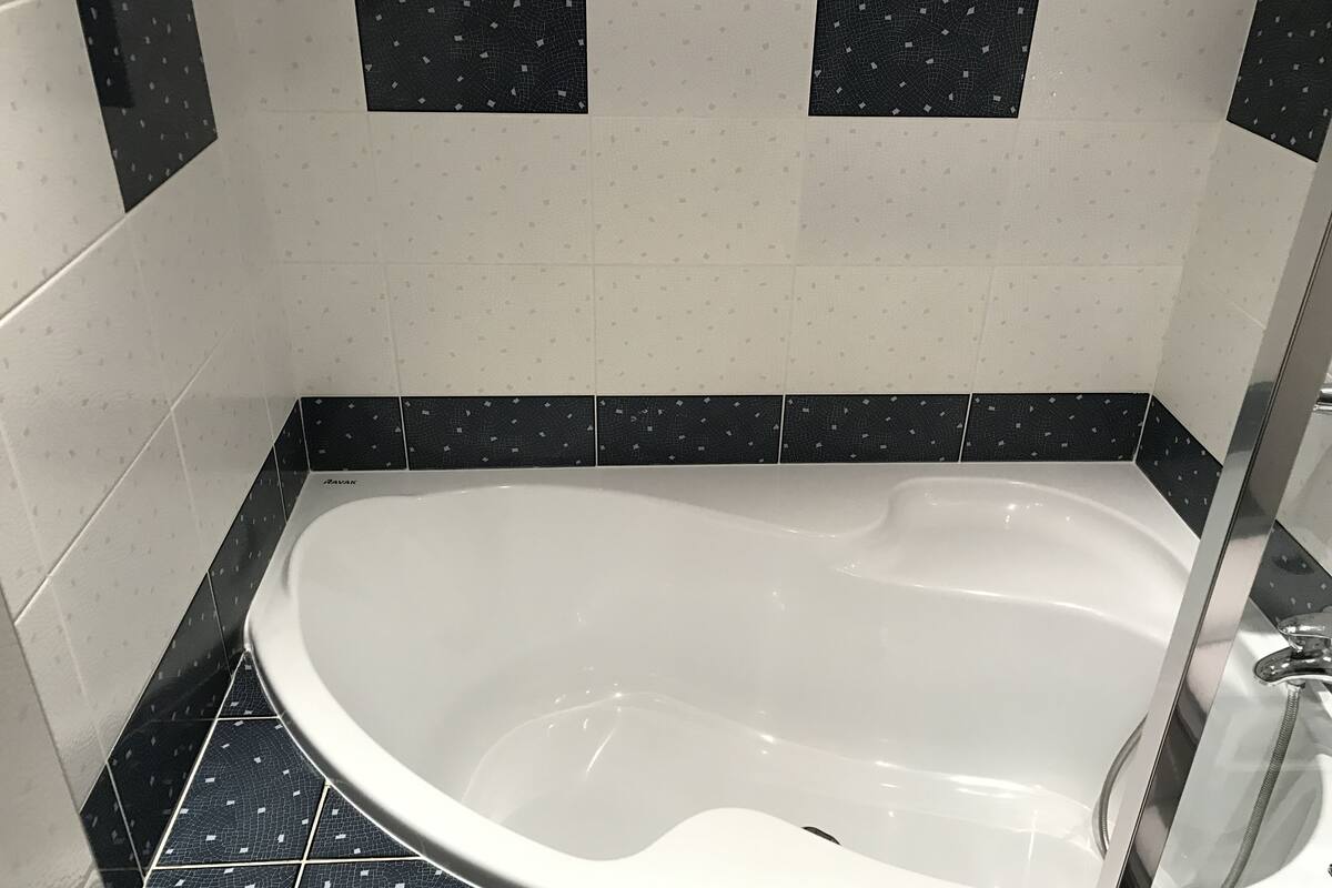 premium suite (suite 009) | bathroom | shower, designer toiletries, hair dryer, slippers