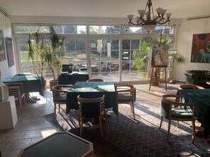 Lunch, dinner, brunch served; international cuisine, garden views 