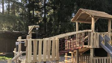 Kids can play on the swing set, slide, and in the shelter.