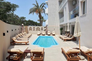 Outdoor pool, pool umbrellas, pool loungers