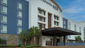 A hotel with a modern design, featuring a prominent entrance with a covered area and a sign that reads "SPRINGHILL SUITES." - SpringHill Suites by Marriott Lake Charles (Lake Charles)