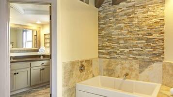 Separate tub and shower, jetted tub, designer toiletries, hair dryer