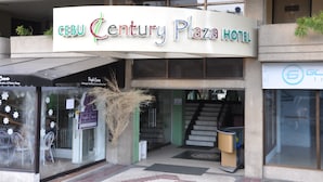 The entrance of Cebu Century Plaza Hotel with a sign above the entrance. - Century Plaza Hotel (Cebu City)