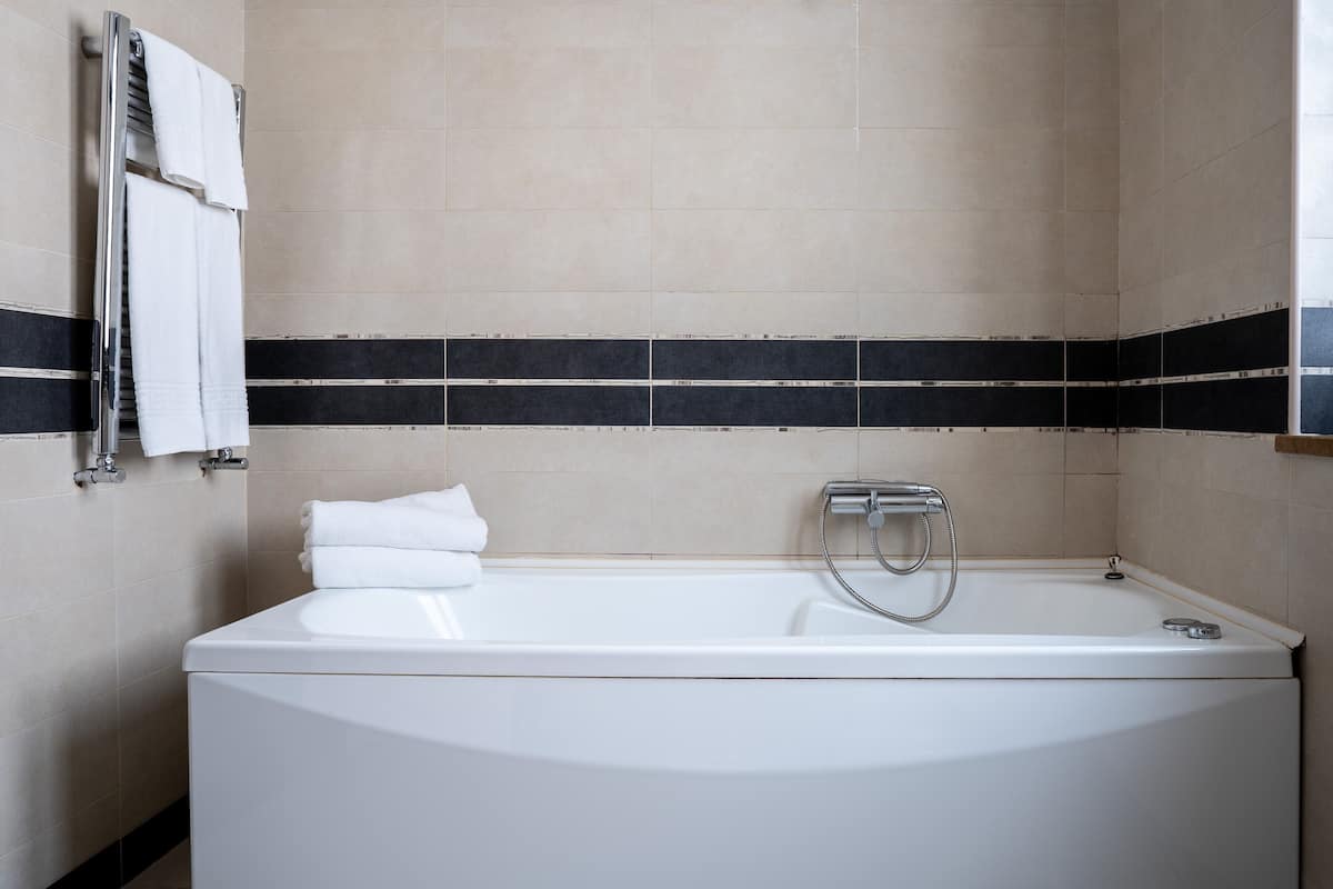 deluxe double room | bathroom | shower, free toiletries, hair dryer, bathrobes