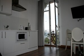 Standard Apartment, 1 Bedroom, Balcony, Partial Sea View | Private kitchen | Fridge, stovetop, electric kettle, toaster