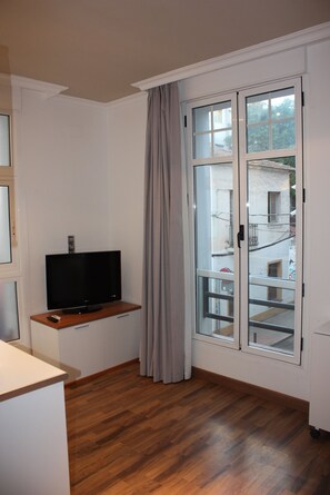 1 slaapkamer, een strijkplank/strijkijzer, babybedden, extra bedden