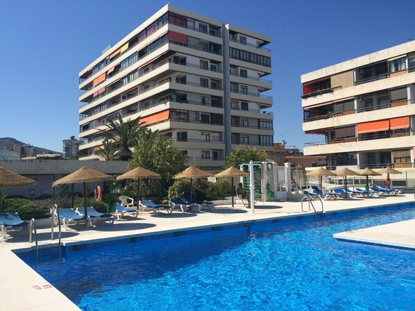 Seasonal outdoor pool, pool loungers