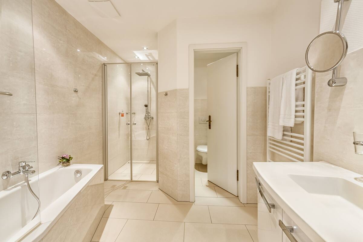 deluxe double room | bathroom | shower, hair dryer, bathrobes, slippers