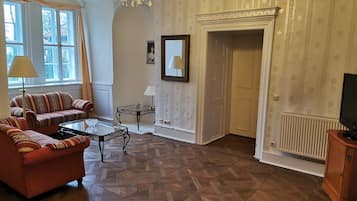 Senior Double Room | Living area | Flat-screen TV