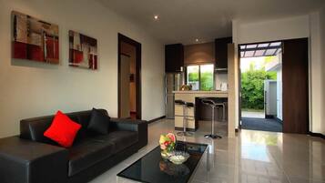 1 bedroom pool villa | Living area | 32-inch LCD TV with cable channels, TV, DVD player