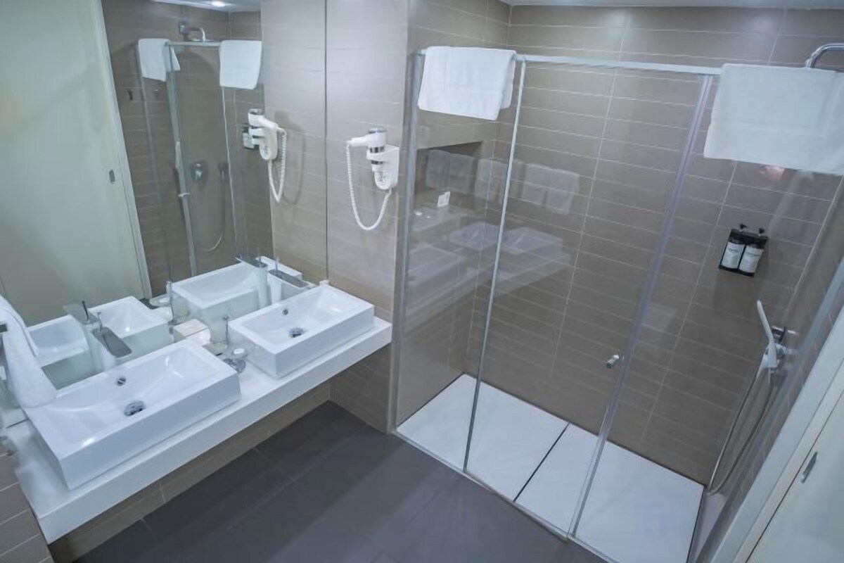 Bathroom | Rainfall showerhead, free toiletries, hair dryer, bathrobes