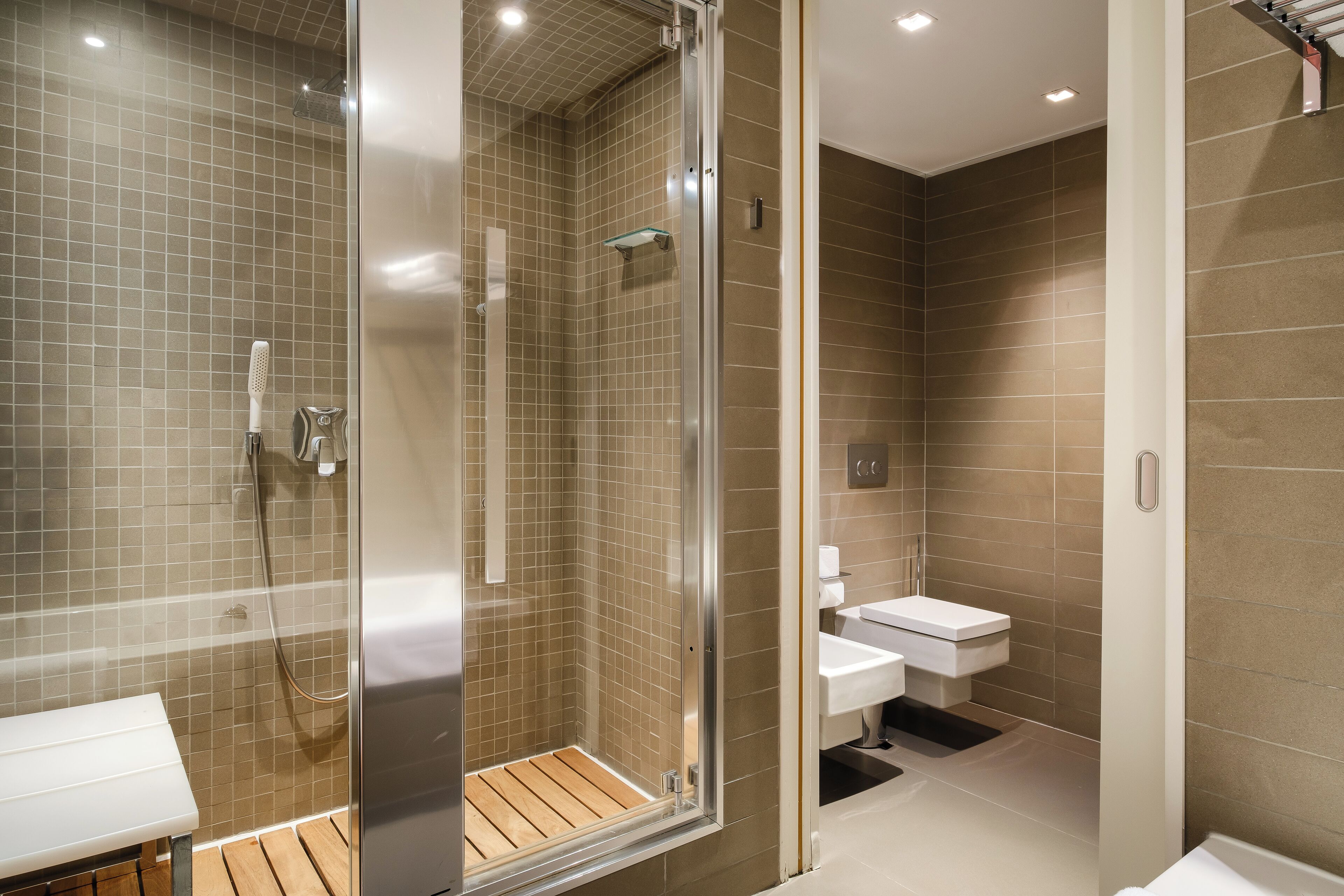 premium suite | bathroom | rainfall showerhead, free toiletries, hair dryer, bathrobes