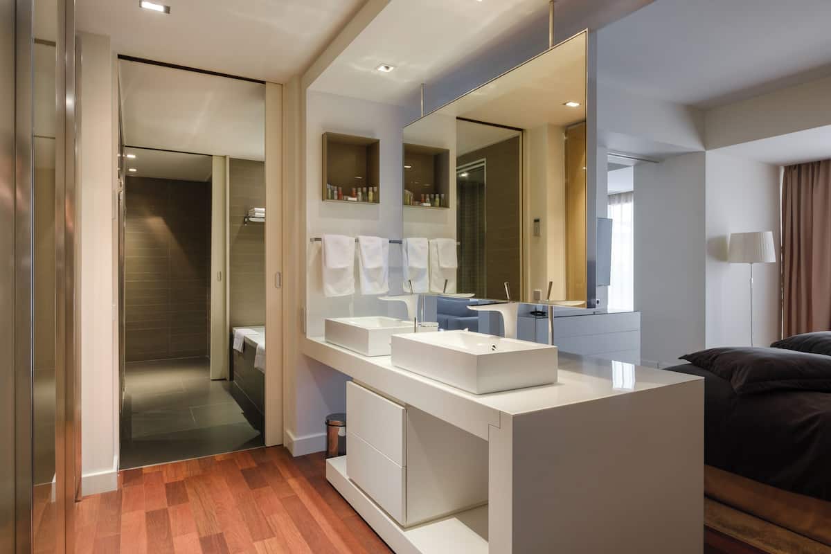 premium suite | bathroom | rainfall showerhead, free toiletries, hair dryer, bathrobes
