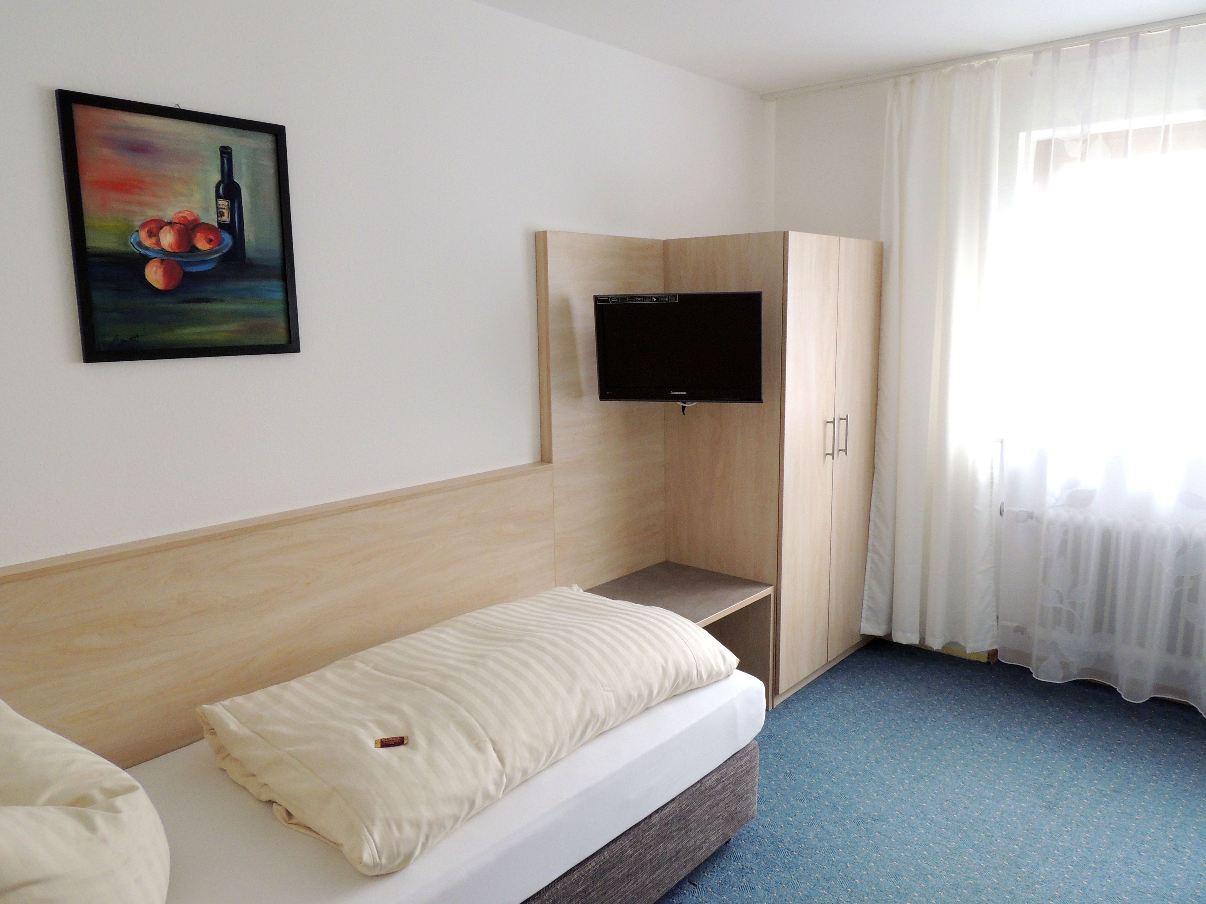 single room | premium bedding, down duvets, desk, blackout curtains