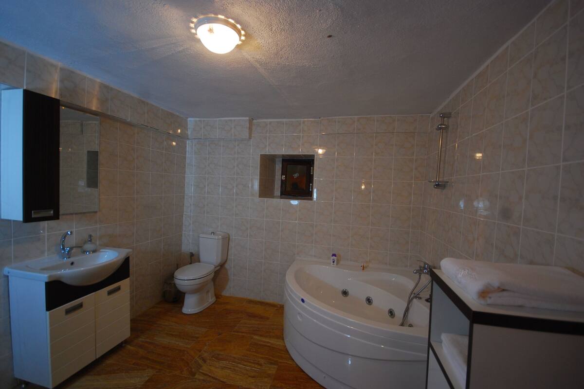 hair dryer, bathrobes, slippers, towels