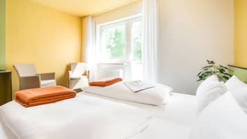 Hypo-allergenic bedding, down duvets, desk, laptop workspace