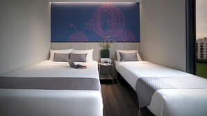A modern hotel room with two beds, a nightstand, and a decorative wall piece. - Hotel 81 Lucky (Singapore)