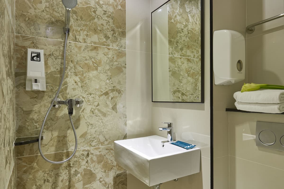 Bathroom | Shower, free toiletries, hair dryer, towels