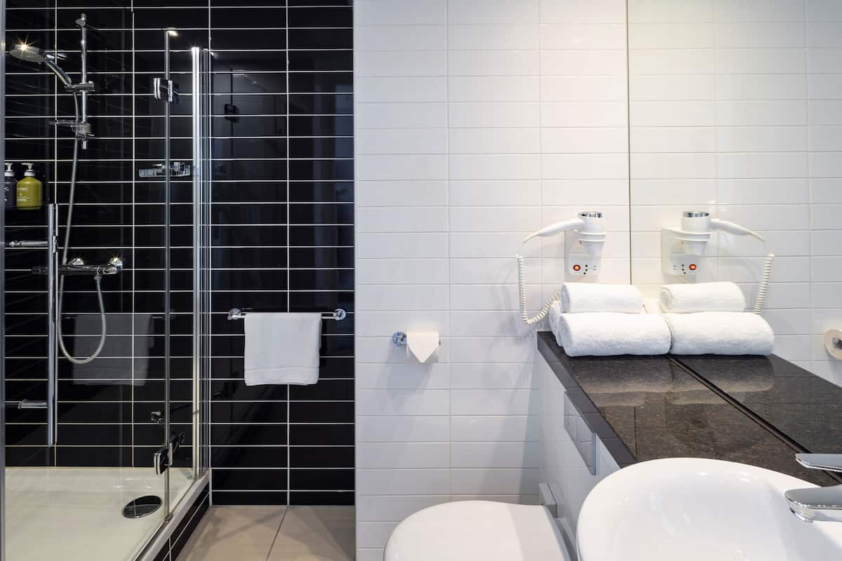 shower, rainfall showerhead, hair dryer, towels