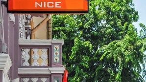 A hotel sign with the name "VALUE HOTEL" and the word "NICE" below it. - Value Hotel Nice (Singapore)