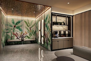 A modern interior with a kitchen area, a seating area, and a decorative wall with plant motifs. - Days Inn by Wyndham Singapore Novena (Singapore)