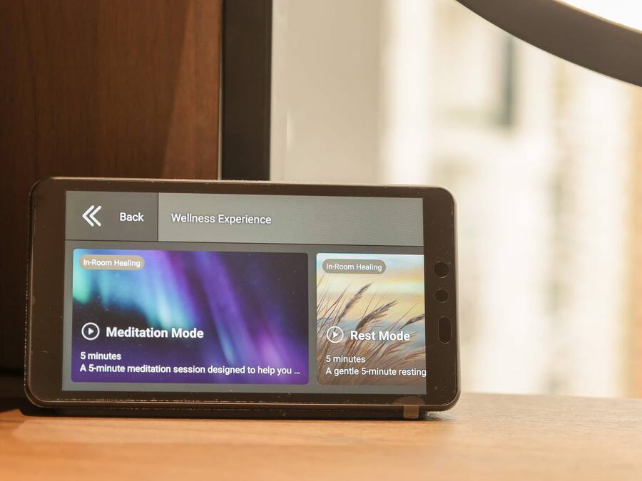A smartphone displaying a wellness app with meditation and rest modes.