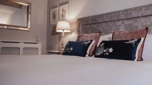 Premium bedding, individually furnished, blackout drapes