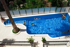 Seasonal outdoor pool, pool umbrellas, sun loungers