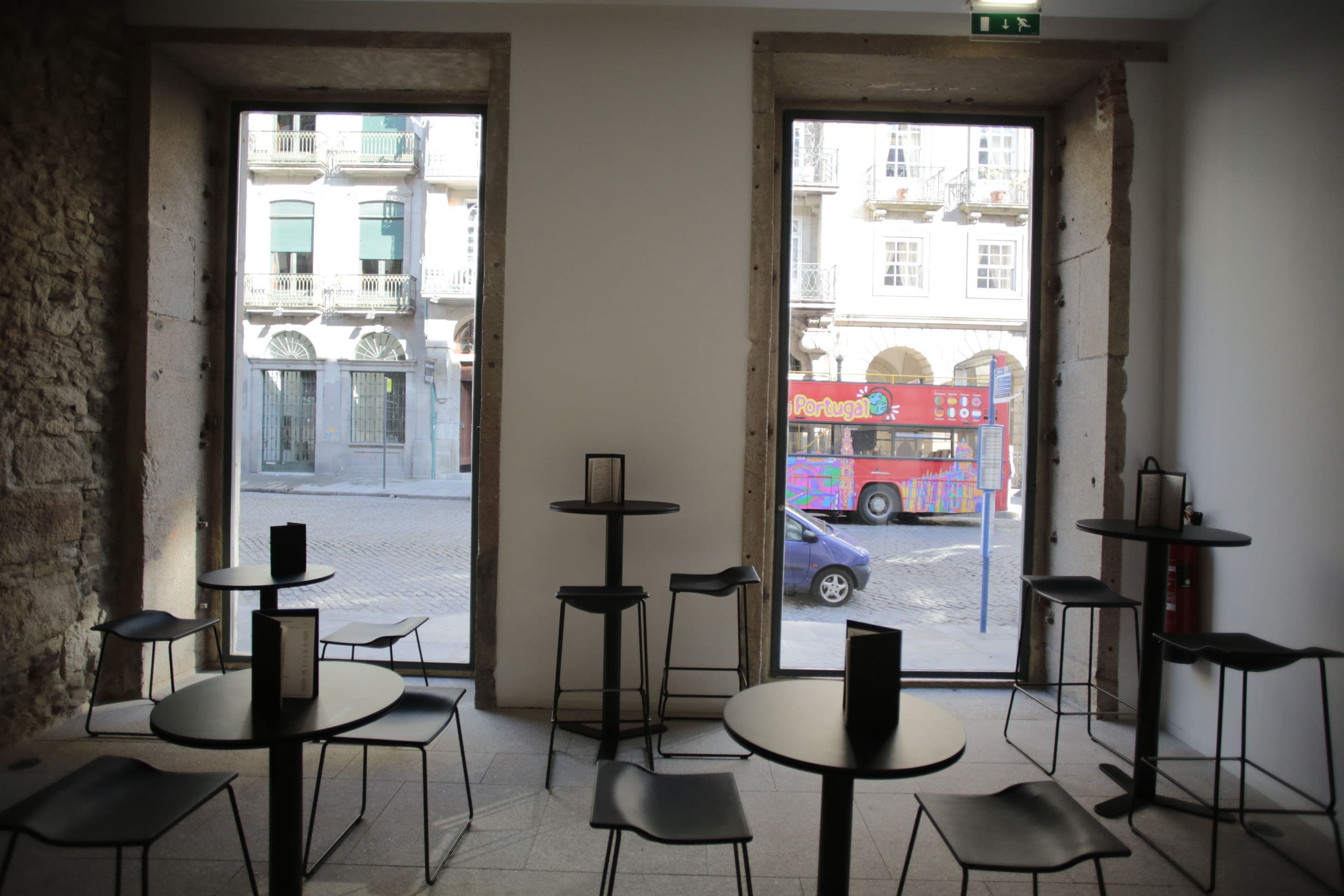A café with tables and chairs arranged for seating.
