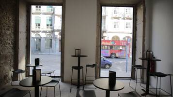 A café with tables and chairs arranged for seating.
