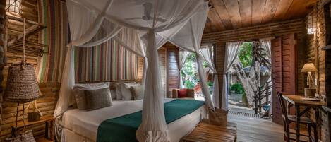 A rustic wooden bedroom with a canopy bed, a small table, and a bench.