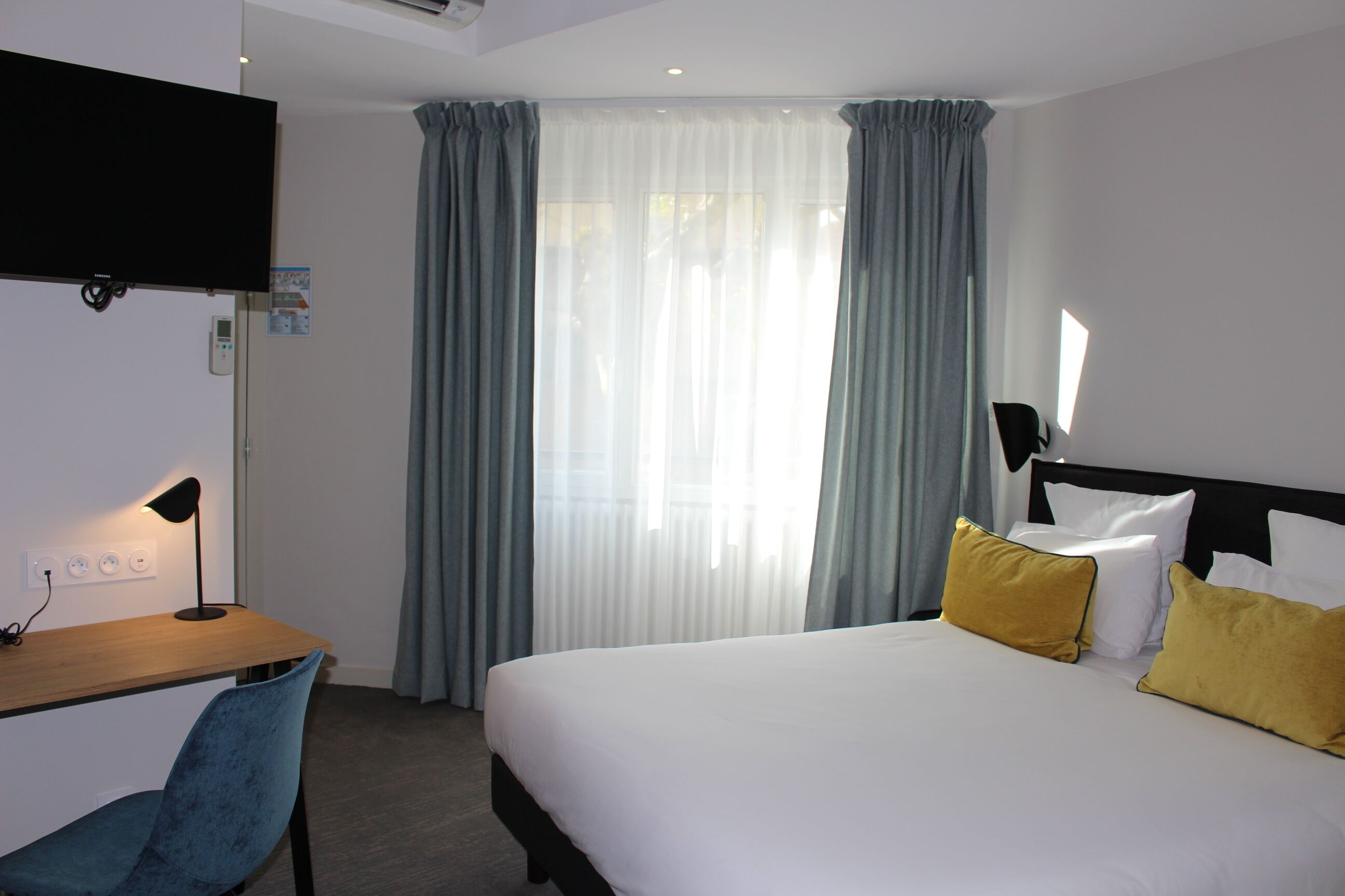 triple room | premium bedding, desk, blackout curtains, soundproofing
