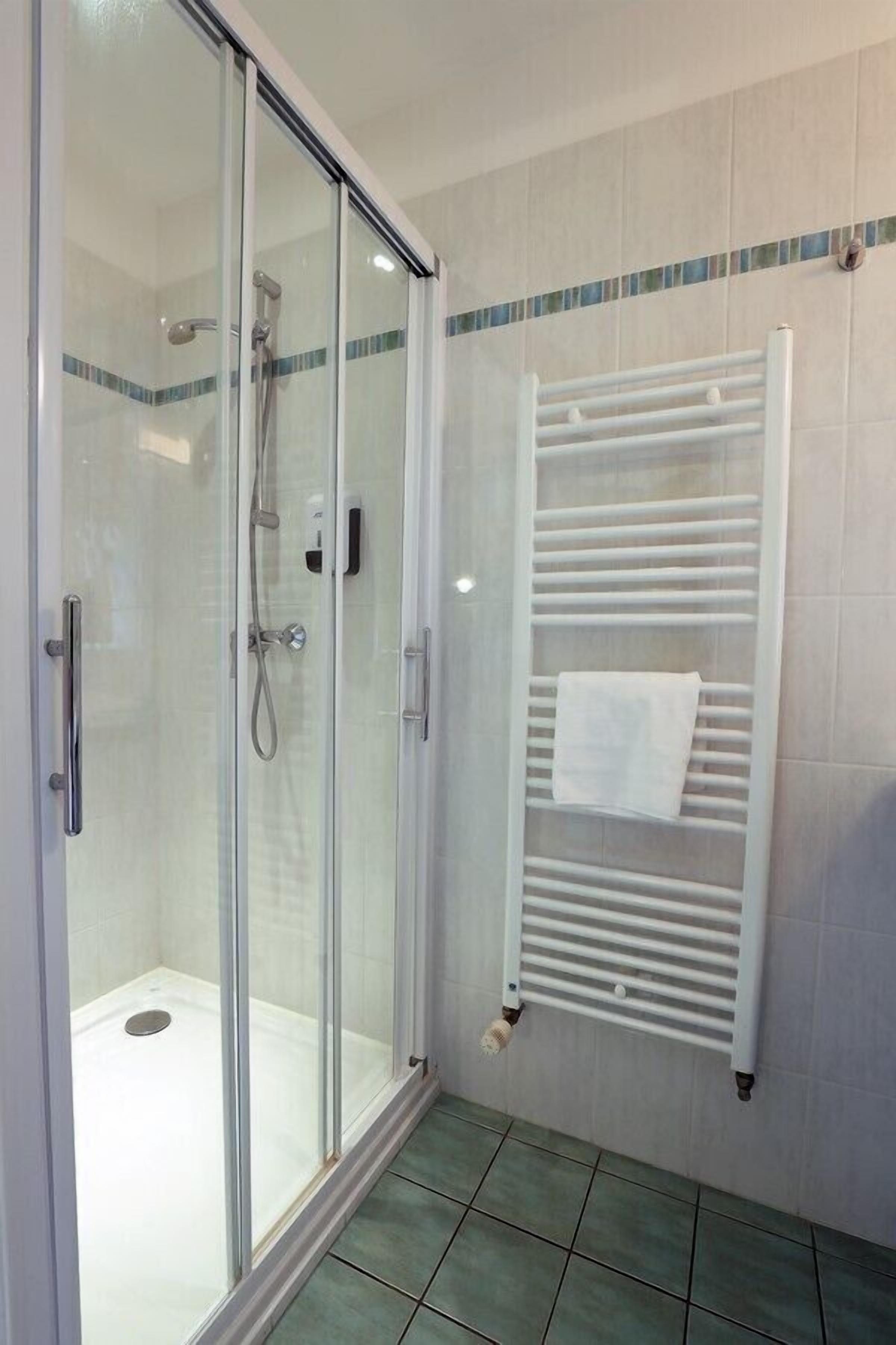 standard room | bathroom | shower, hair dryer, towels, soap