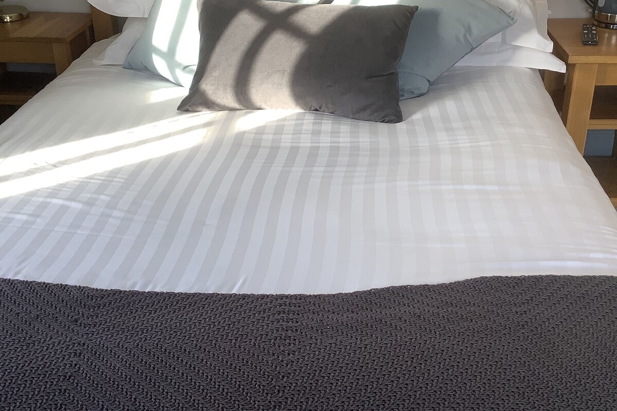 Premium bedding, desk, iron/ironing board (on request), WiFi (free)