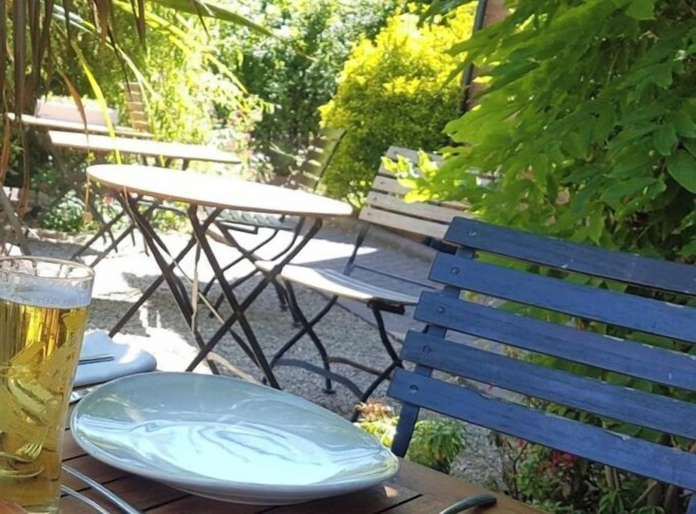 Breakfast, lunch, dinner served; Modern European cuisine, garden views 