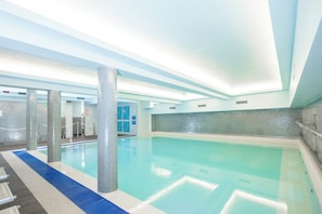 Seasonal outdoor pool, open 11:00 AM to 7:00 PM, pool loungers