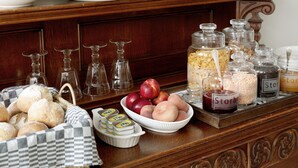 A buffet setup with various food items and serving ware. - Boutique Hotel Grote Gracht (Maastricht)