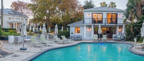 Outdoor pool, open 10:00 AM to 8:00 PM, pool umbrellas